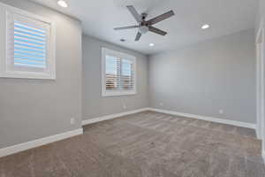 Spare room with recessed lighting, light carpet, and a ceiling fan