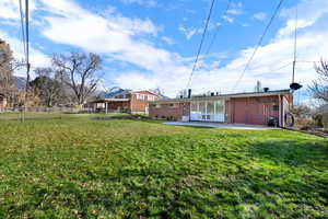 Back of property featuring a patio and brick siding