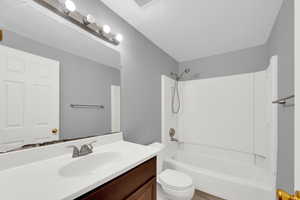 Bathroom featuring  shower combination and vanity