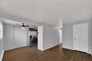 Unfurnished living and dining area with a brand new ceiling fan and new LVP flooring