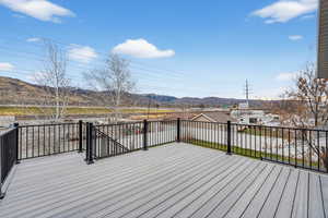 Wooden terrace featuring a mountain view