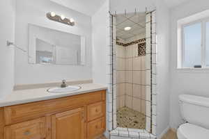 Bathroom with vanity and a shower stall