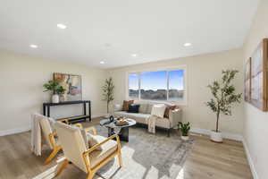 Living area featuring recessed lighting and light wood-type flooring