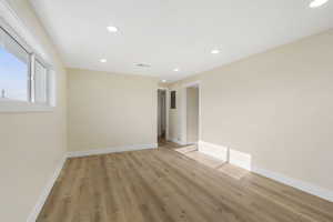 Unfurnished room featuring light wood-style flooring and recessed lighting