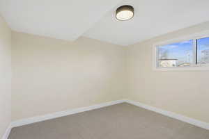 Empty room with baseboards and carpet floors