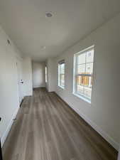 Empty room featuring wood finished floors and baseboards
