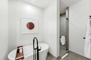 Bathroom with a soaking tub and a shower stall