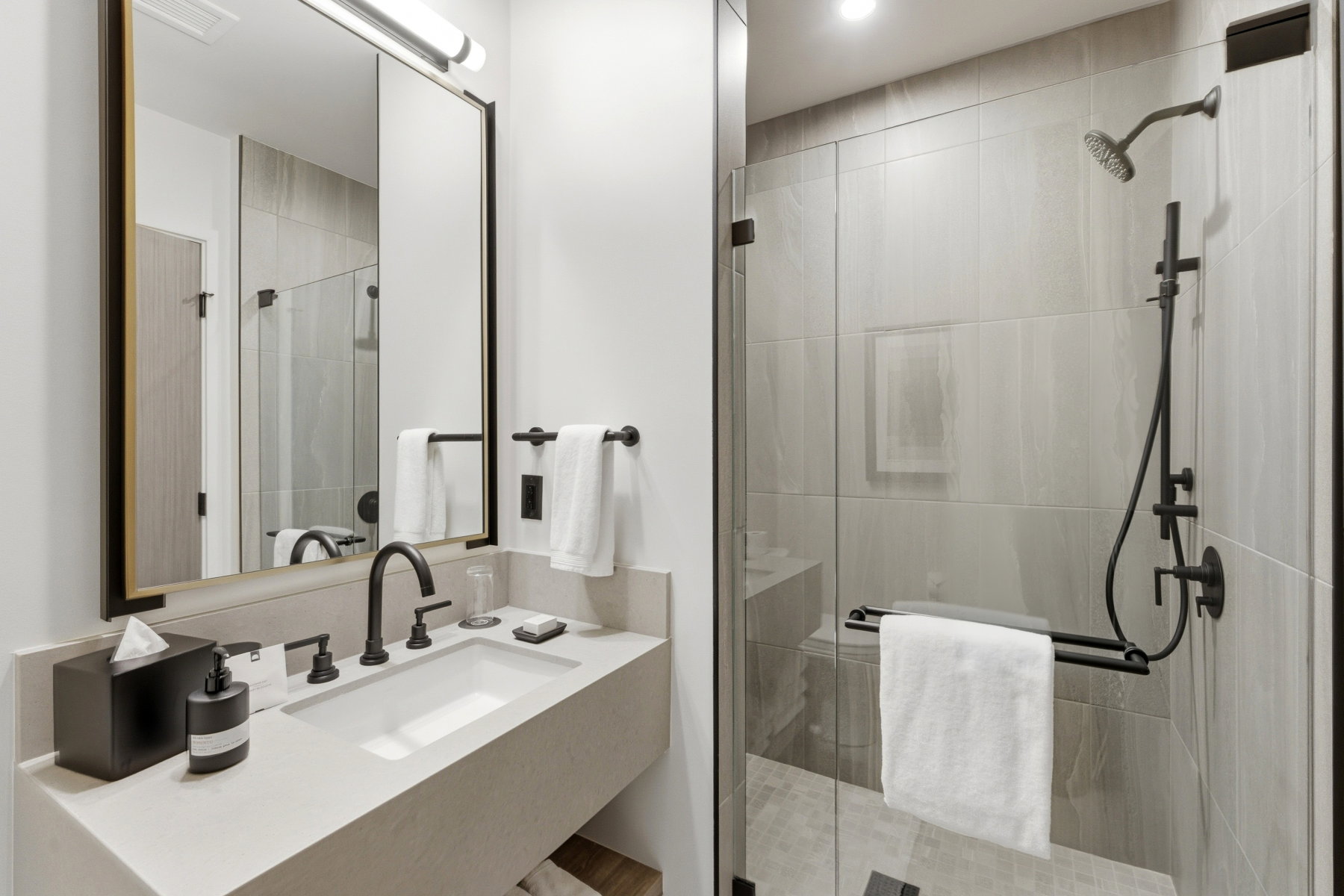 Full bath with vanity and a shower stall