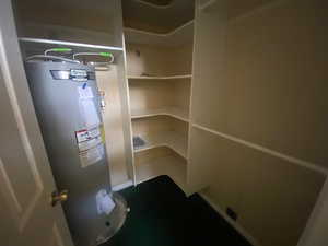 Utility room featuring water heater