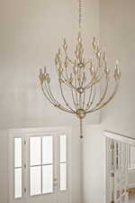 Detailed view of a chandelier and french doors