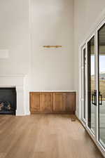 Unfurnished living room with light wood-style flooring and a fireplace