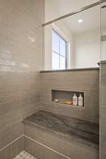 Bathroom with a tile shower