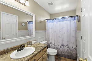 Full bathroom with a shower with curtain and vanity