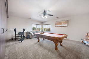 Recreation room featuring billiards, carpet, and a ceiling fan