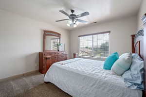 Bedroom featuring carpet and a ceiling fan