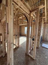 Misc room featuring arched walkways