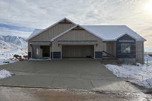 View of front of house featuring a garage and driveway