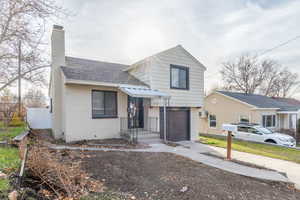 Tri-level home with a new roof, new exterior paint and a built in single car garage.