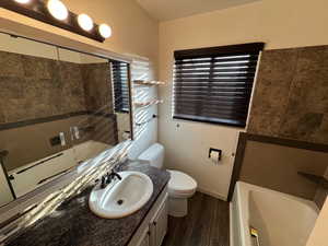 Bathroom with vanity and dark wood-type flooring