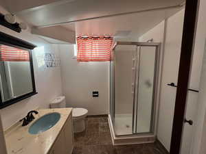 Bathroom with vanity and a shower stall
