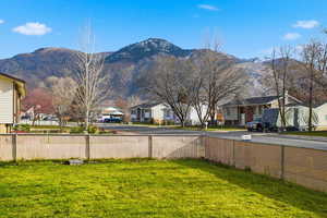 View of yard featuring a residential view and a mountain view