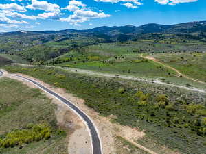 Aerial view of sparsely populated area with a mountainous background