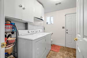 Laundry room with rear entrance.