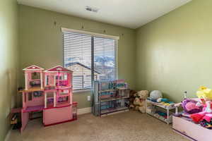Rec room with carpet floors and baseboards