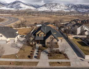 Aerial perspective of suburban area with a mountain backdrop