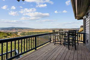 Wooden deck featuring a mountain view