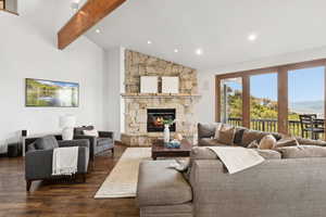 Living area featuring a stone fireplace, wood finished floors, and recessed lighting