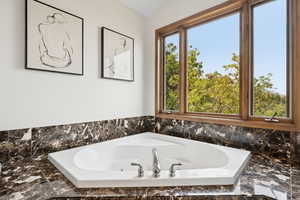 Bathroom with a tub to relax in