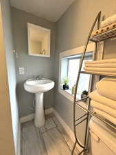 Bathroom featuring baseboards and toilet