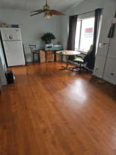Office with ceiling fan, wood finished floors, and lofted ceiling