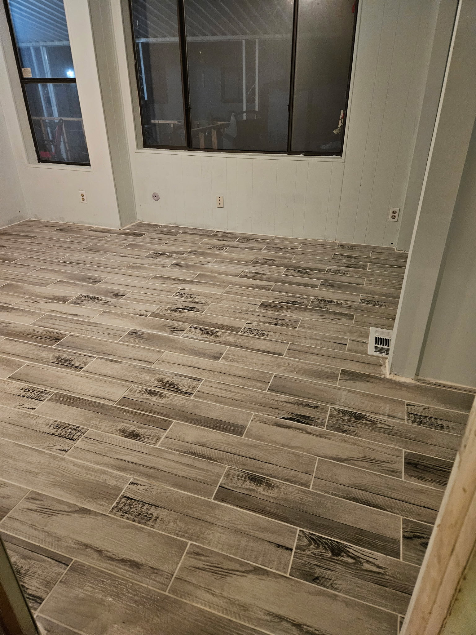 Empty room featuring wood tiled floors