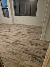 Empty room featuring wood tiled floors