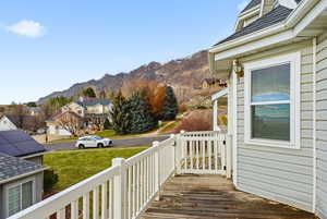 Deck with a mountain view and a residential view