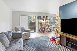 Living room featuring wood finished floors and a textured ceiling