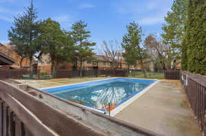 View of swimming pool with a residential view