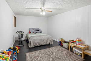 Bedroom featuring a ceiling fan and wood finished floors