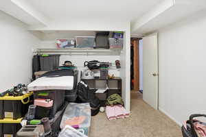 Bedroom with carpet floors and baseboards