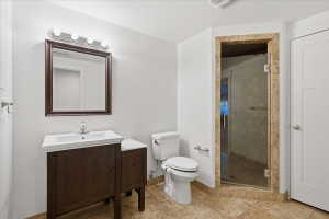 Bathroom with vanity and a shower stall