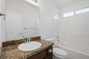 Bathroom featuring vanity and bathing tub / shower combination