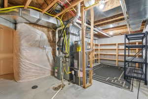 Unfinished basement with gas water heater and heating unit