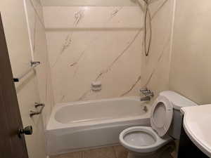 Full bathroom with vanity, tub / shower combination, and tile patterned floors