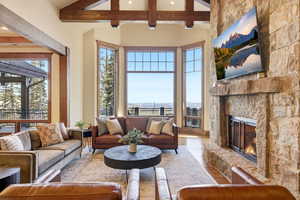 Living room with wood-type flooring and a fireplace
