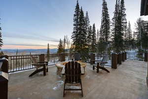 View of patio with an outdoor fire pit and a mountain view