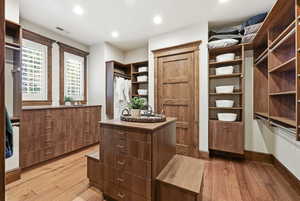 Walk in closet featuring light wood finished floors