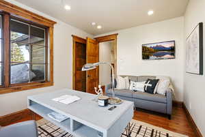 Office area featuring hardwood / wood-style floors and recessed lighting