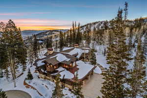 Snowy aerial view featuring a mountain view
